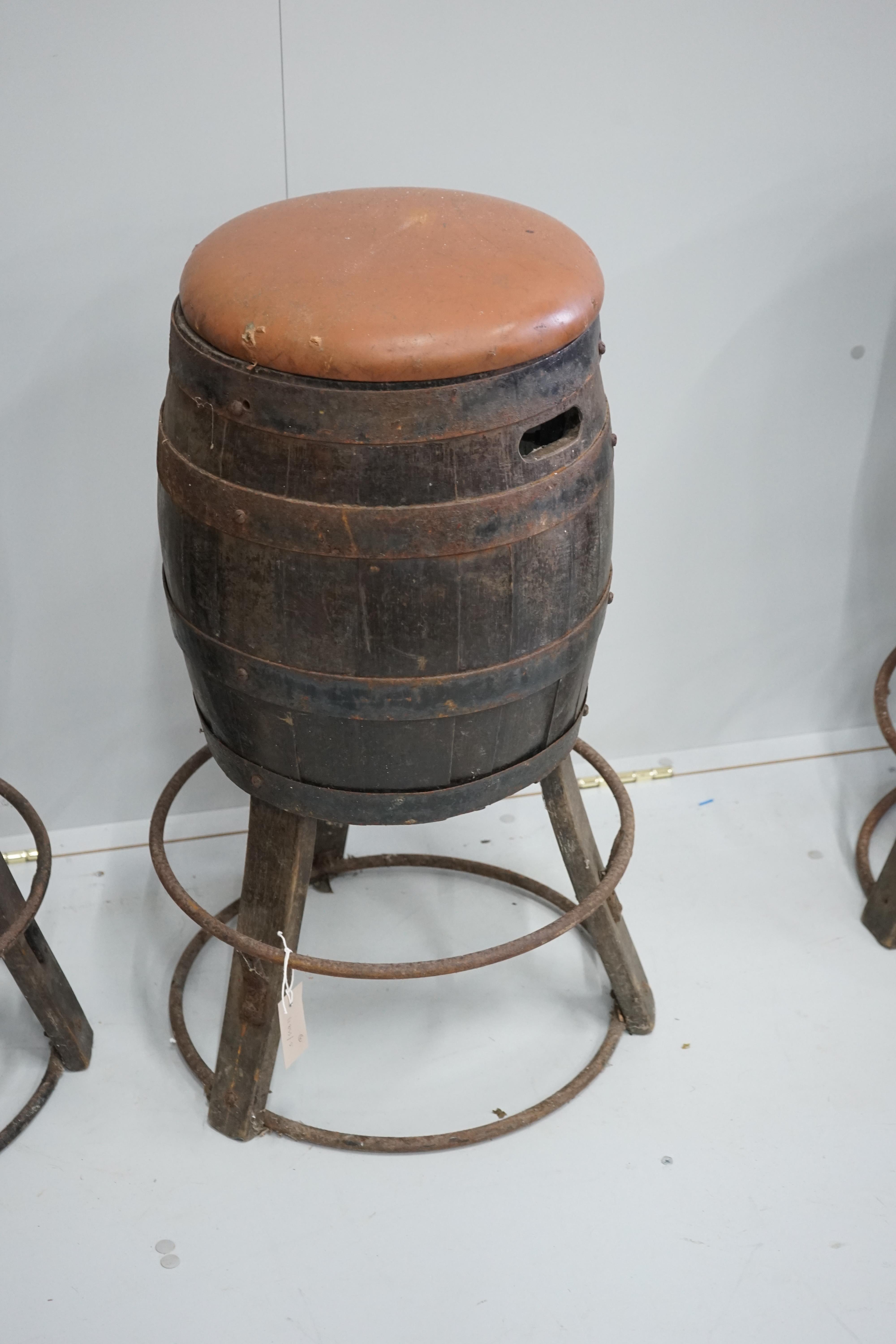A set of four barrel bar stools, height 73cm